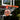 A basketball is going through the hoop on an outdoor basketball stand