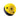 A yellow and black ball with holes used for indoor climbing or training in a gym setting