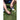 Player places a golf ball on a tee on the grass during a game or practice session