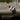 Boy hits a baseball with a bat on a baseball field during daytime