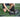 Person packs equipment into a black bag on a sports field