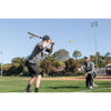 Two men getting ready to hit a SKLZ premium Imapct baseball on a baseball field with sunny blue skies