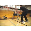 Man practicing with heavy weight control basketball with his coach