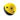 A yellow and black climbing helmet with ventilation holes on a plain white background