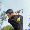 man practicing golf with SKLZ Gold flex golf swing trainer