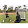 Young boy practicing baseball with his trainer using SKLZ's quickster net 