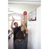 Kids playing with SKLZ pro mini hoop in their house