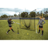 Two ladies practicing with Sklz's soccer Vault net
