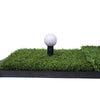 Close up view of green turf featuring a golf ball on large tee