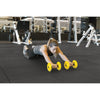 Woman sing the SKLZ COREwheels during her workout to help develop dynamic core strength