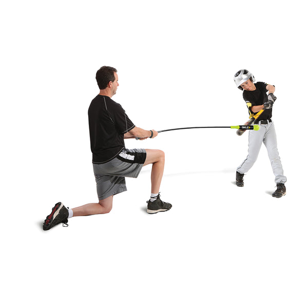 Coach training young boy with SKLZ target swing trainer 