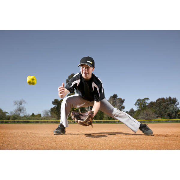 Young boy practicing with SKLZ reaction baseball