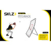 Young boy ready to catch baseball in front of SKLZ baseball net