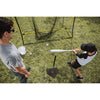 A preteen boy is doing baseball practice with SKLZ 360 Tee with his coach
