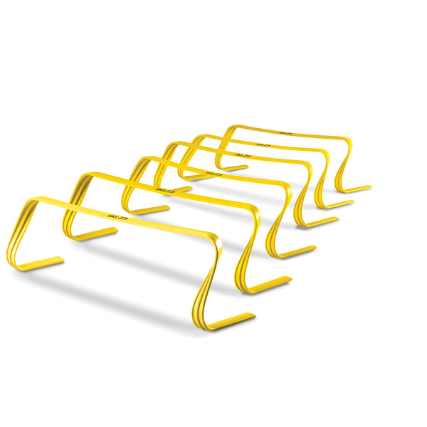 Six yellow speed hurdles in a row.
