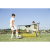 Two kids practicing with SKLZ's soccer trainer