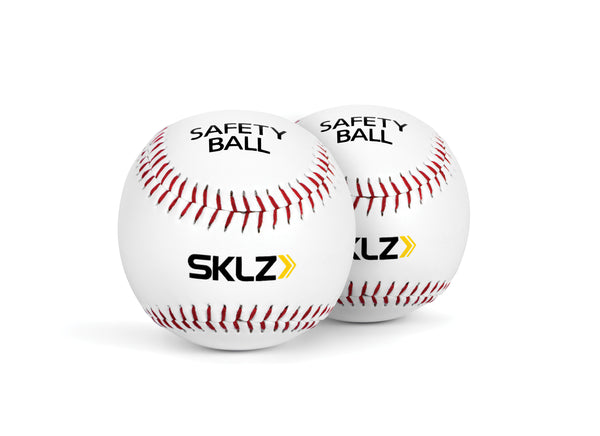 Two white SKLZ practice baseballs, one in front and the other behind the first ball