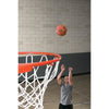 Man throwing square up ball in a basket