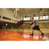 Man practicing basketball with SKLZ's  solo assist sports net